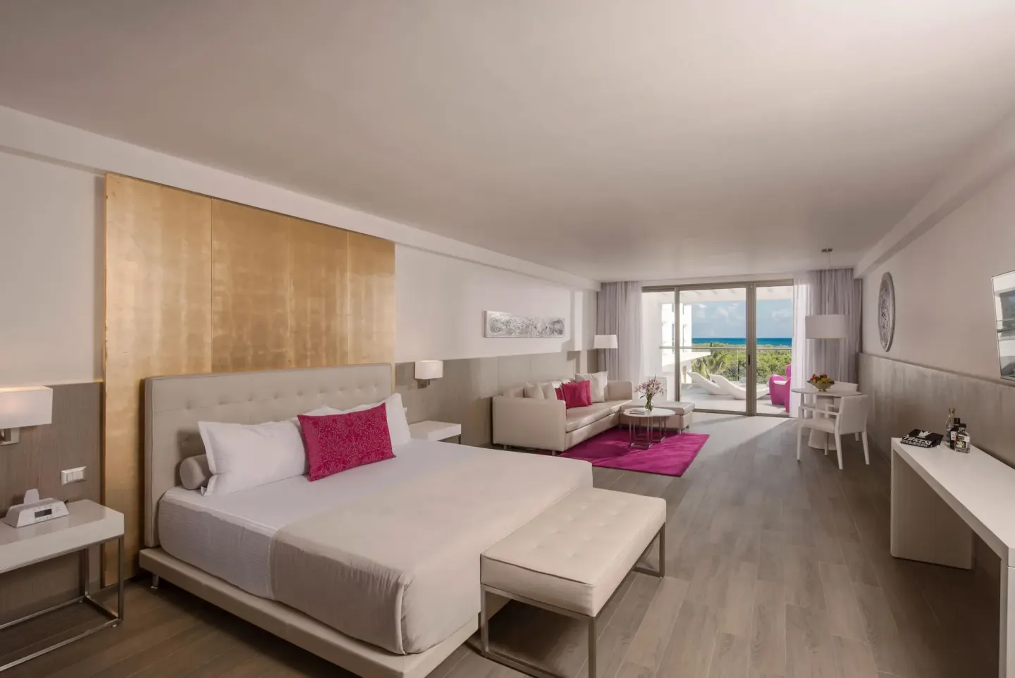 Deluxe Room with king bed, sitting area, and ocean view at Platinum Yucatan Princess