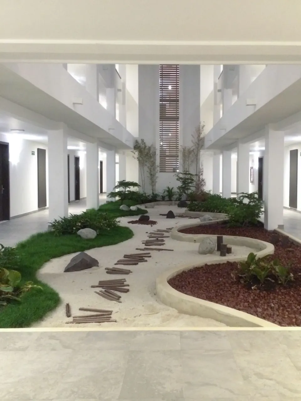 Interior garden corridor outside rooms at Platinum Yucatan Princess.