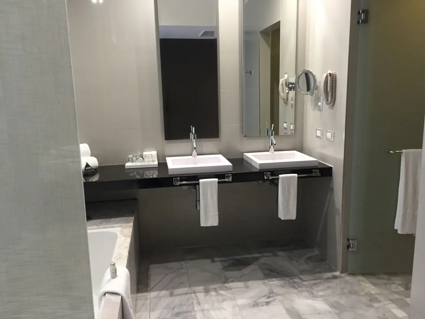Bathroom with double sinks, mirrors, tub, and shower at Platinum Yucatan Princess.
