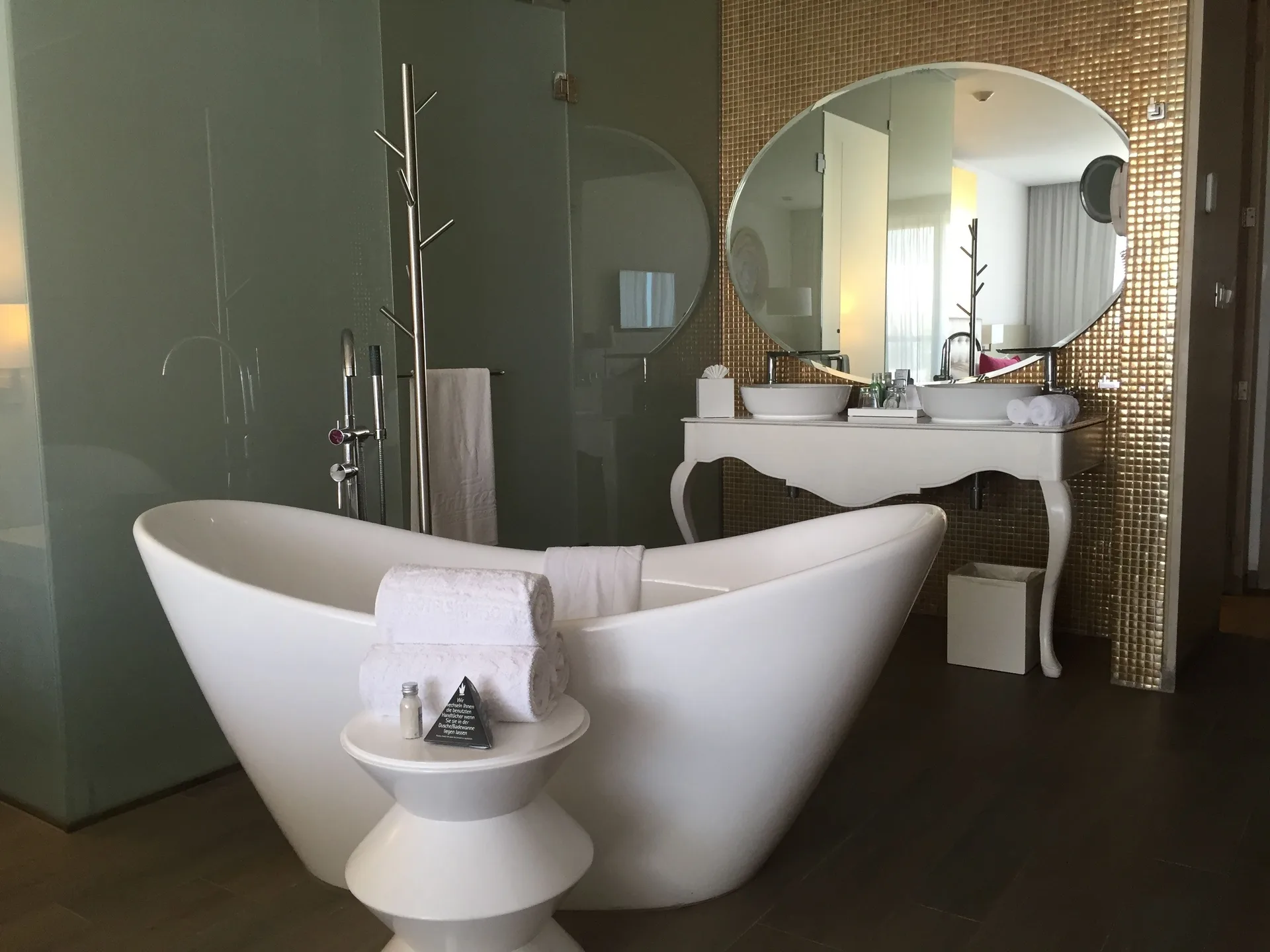 Freestanding tub and double vanity in a round bed suite bathroom at Platinum Yucatan Princess.