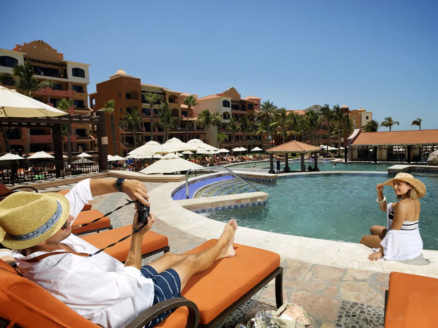 Guests lounging beside the pool at Playa Grande Resort & Grand Spa.