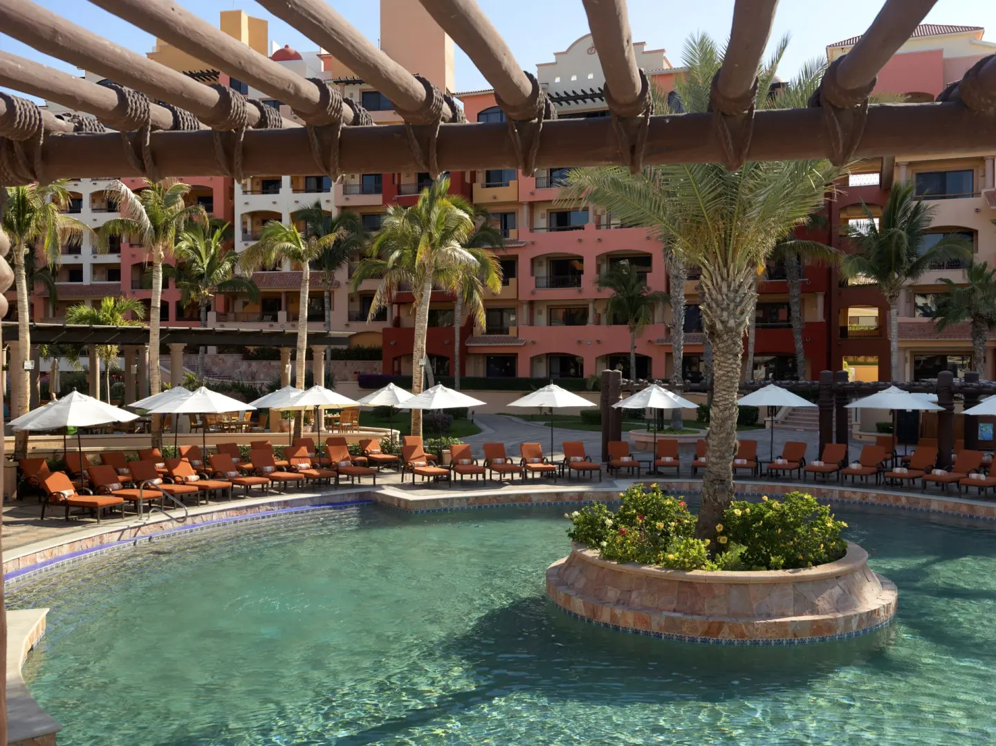 Palm island in the pool courtyard at Playa Grande Resort & Grand Spa.