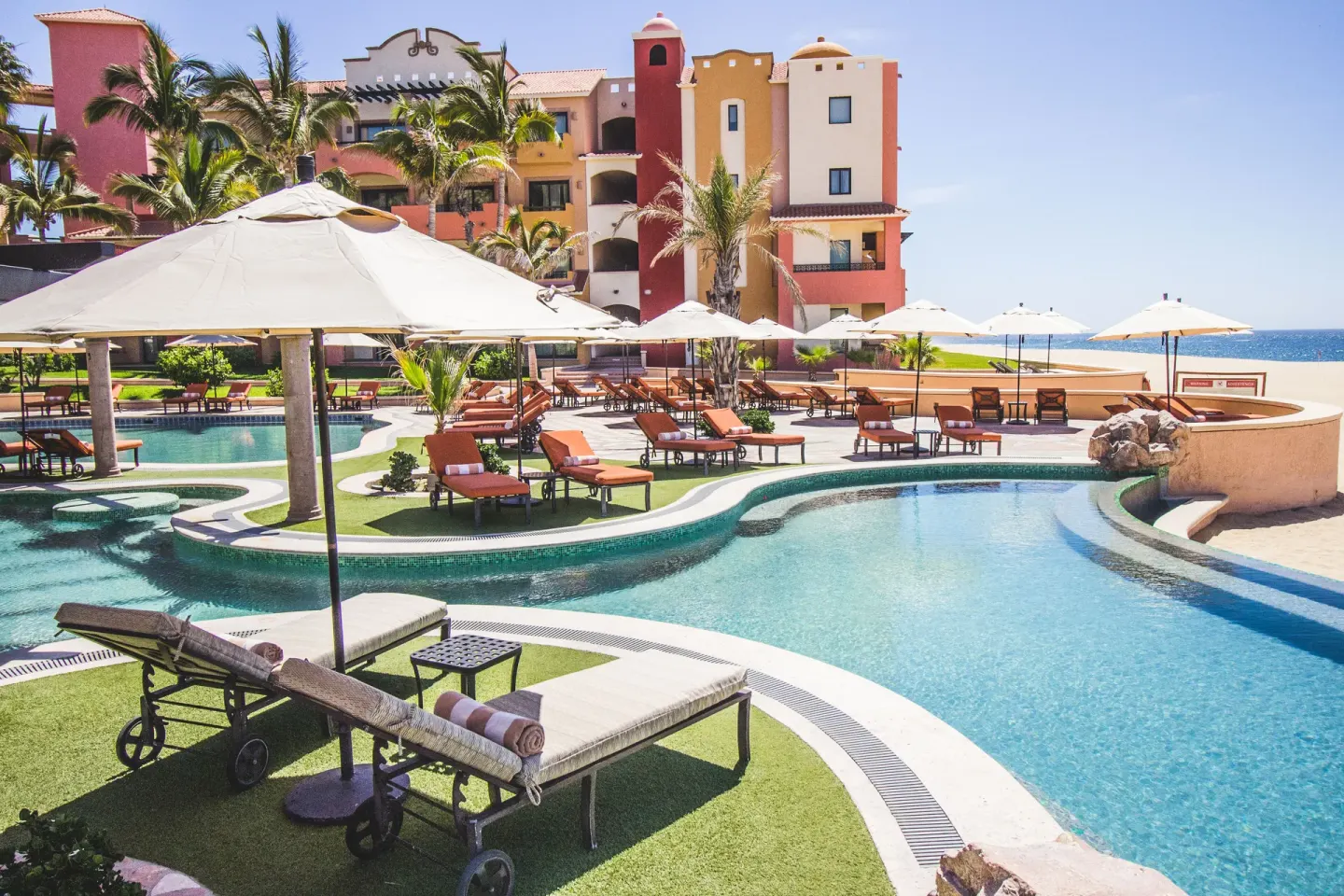 Terraced pools, loungers, and ocean views at Playa Grande Resort & Grand Spa.