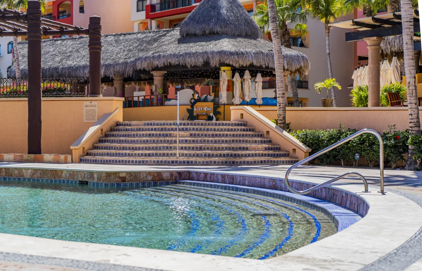 Pool steps leading toward La Taqueria at Playa Grande Resort & Grand Spa.