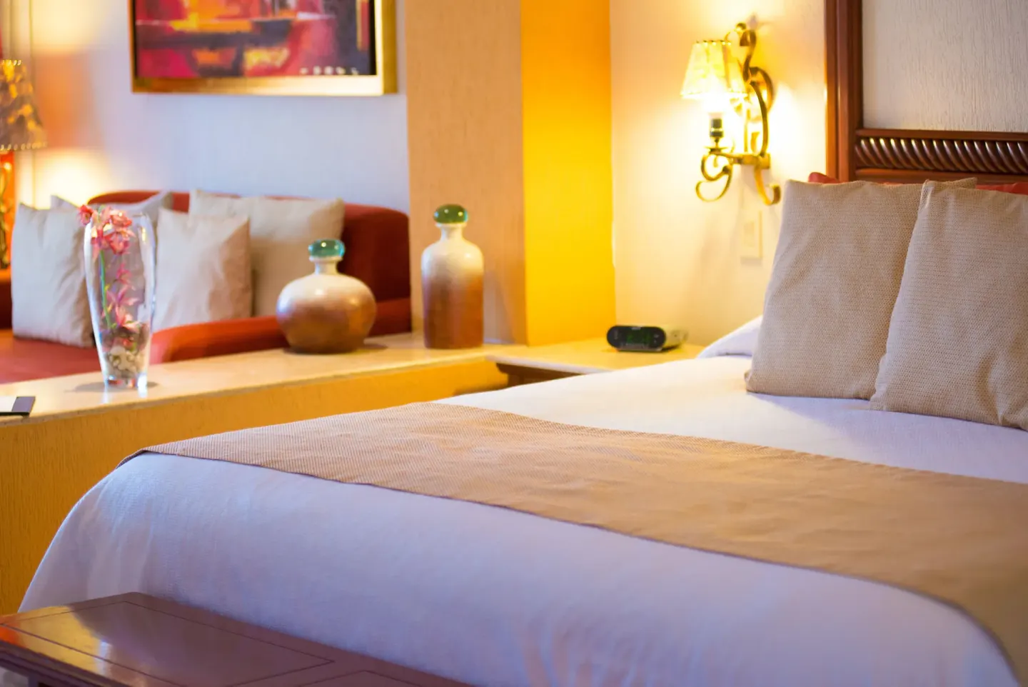 Junior Studio bed and sofa seating area at Playa Grande Resort & Grand Spa.