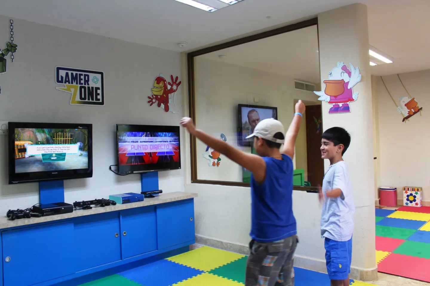 Children play video games in the kids club at Plaza Pelicanos Club Beach Resort.