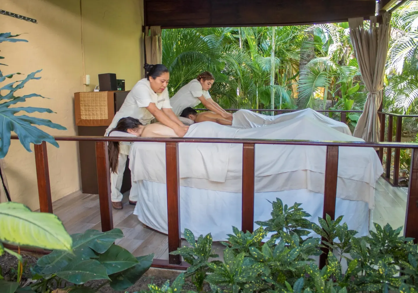 Outdoor couples massage area in tropical gardens at Plaza Pelicanos Club Beach Resort.