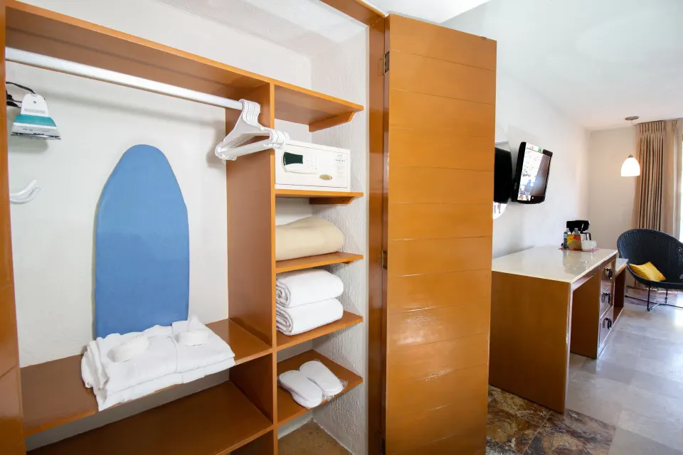 Superior Room closet and storage area at Plaza Pelicanos Club Beach Resort.