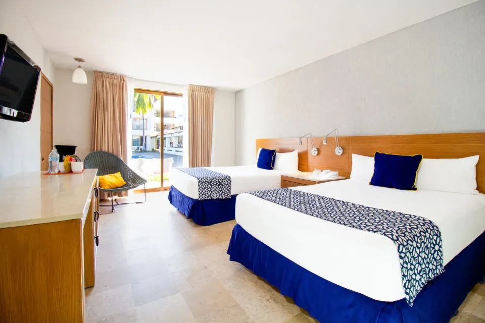 Superior Room with two beds and balcony view at Plaza Pelicanos Club Beach Resort.