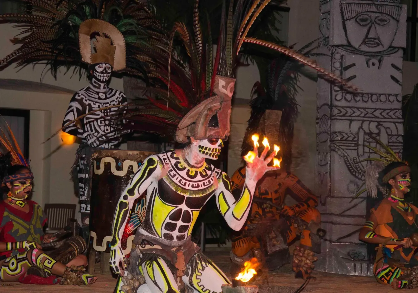Costumed fire performance at Plaza Pelicanos Grand Beach Resort.