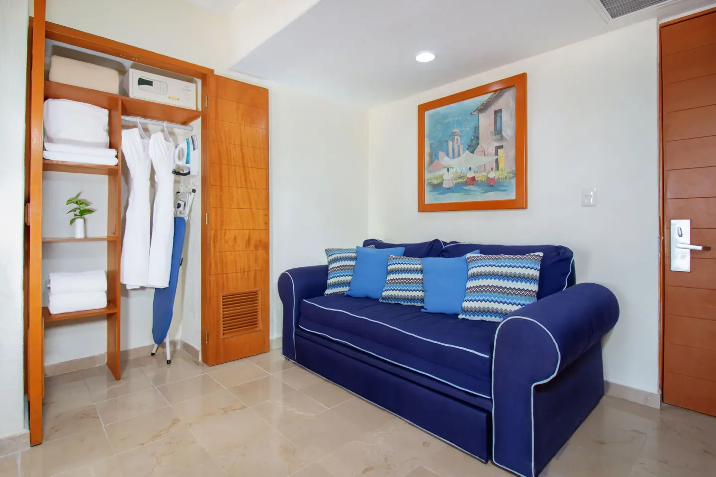 Standard Room sitting area and open closet at Plaza Pelicanos Grand Beach Resort.