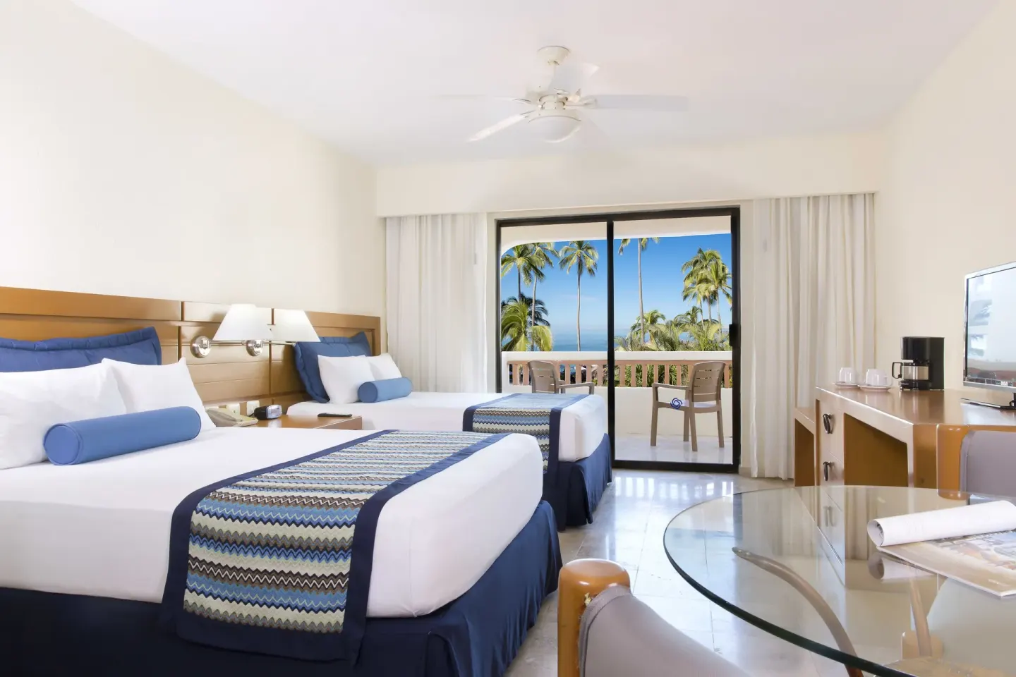 Standard Room with two beds and balcony at Plaza Pelicanos Grand Beach Resort.