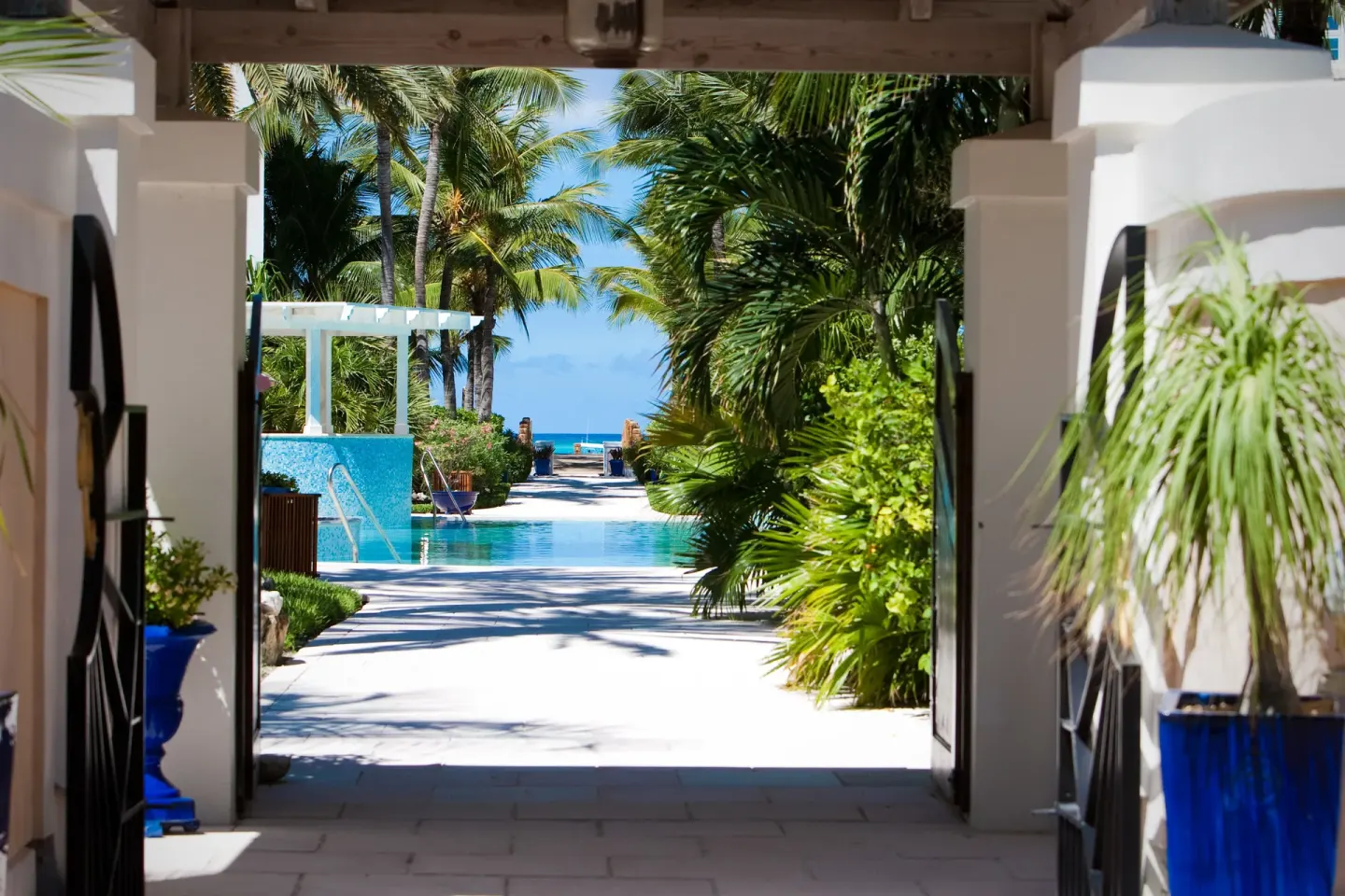 Garden walkway leading toward the pool and sea at Point Grace.