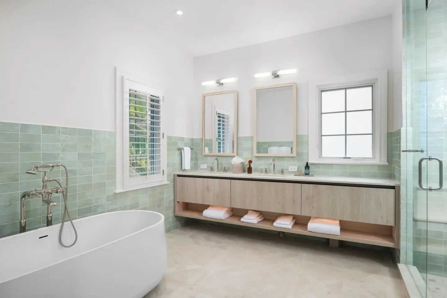 Oceanfront three-bedroom luxury suite bathroom with tub and double vanity at Point Grace.