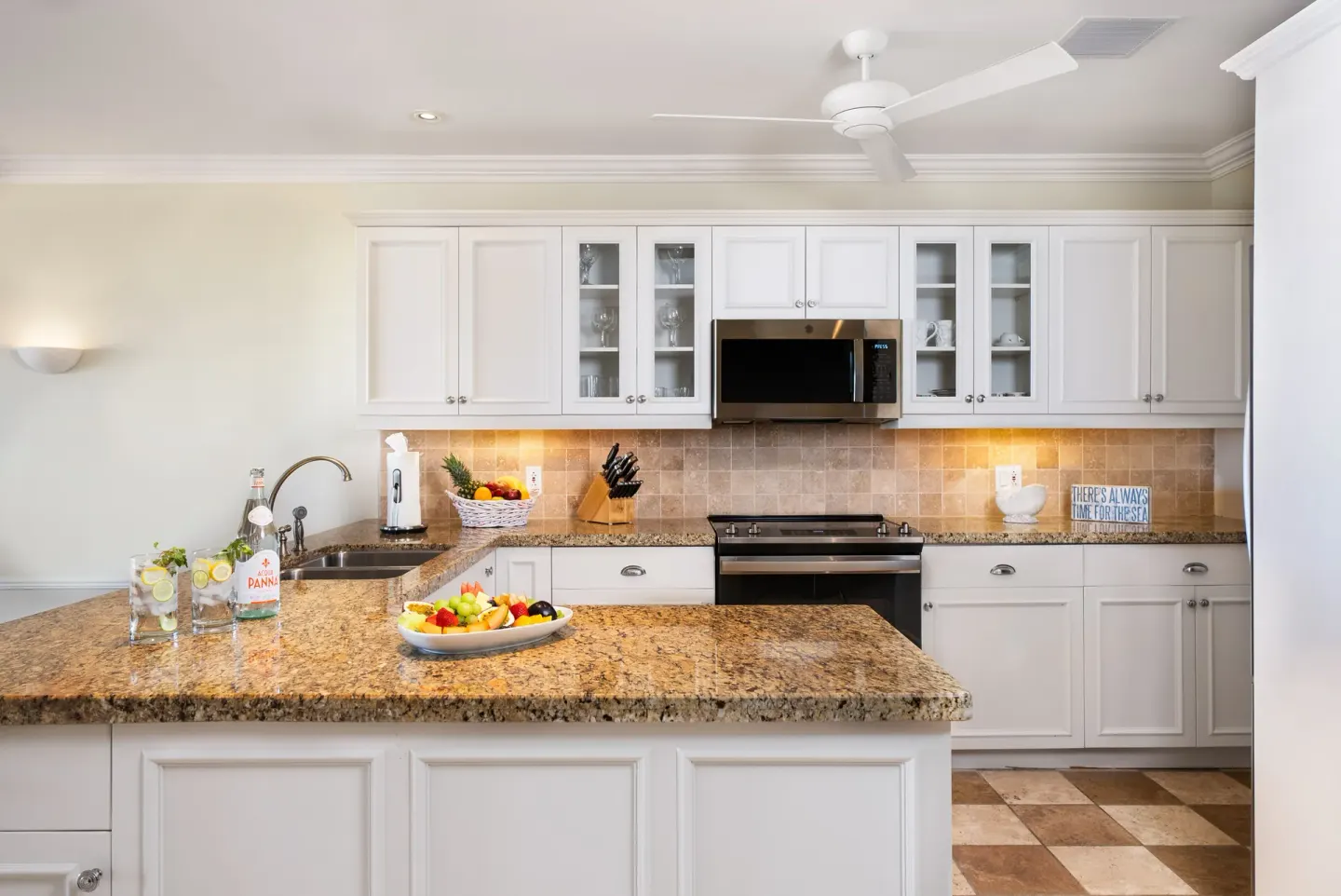 Granite kitchen island in a Pool View Cottage 1 Bedroom Suite at Point Grace.