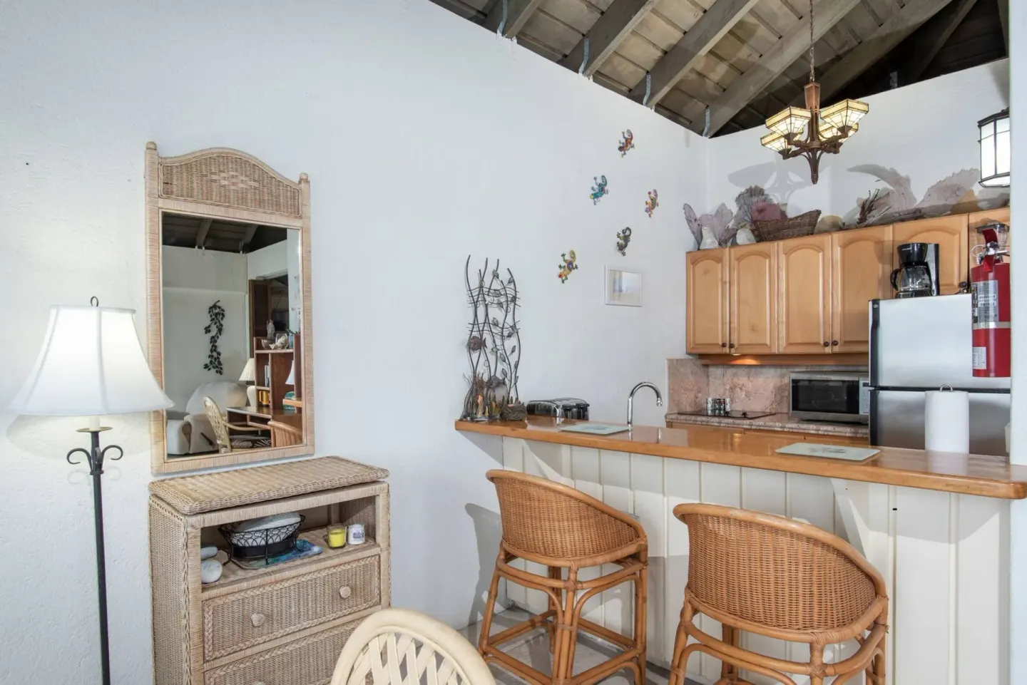 Breakfast bar and kitchenette with wicker seating at Point Pleasant Resort.