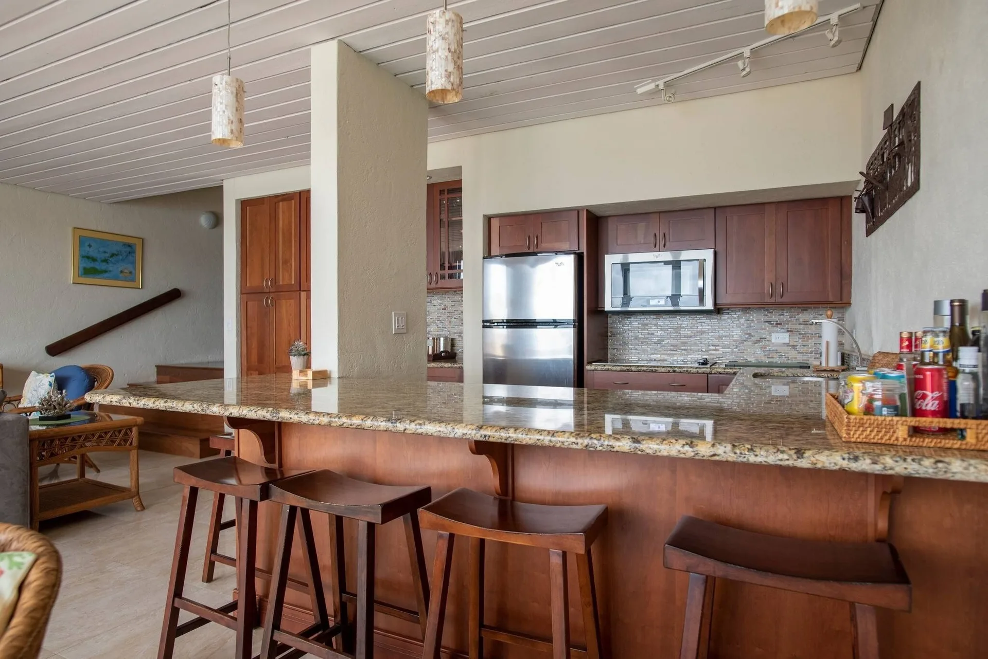Granite breakfast bar and wood-cabinet kitchen at Point Pleasant Resort.