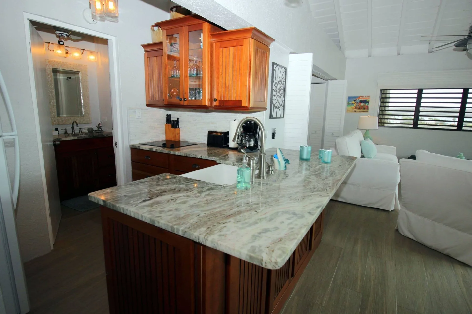 Kitchen island beside a bright sitting area at Point Pleasant Resort.