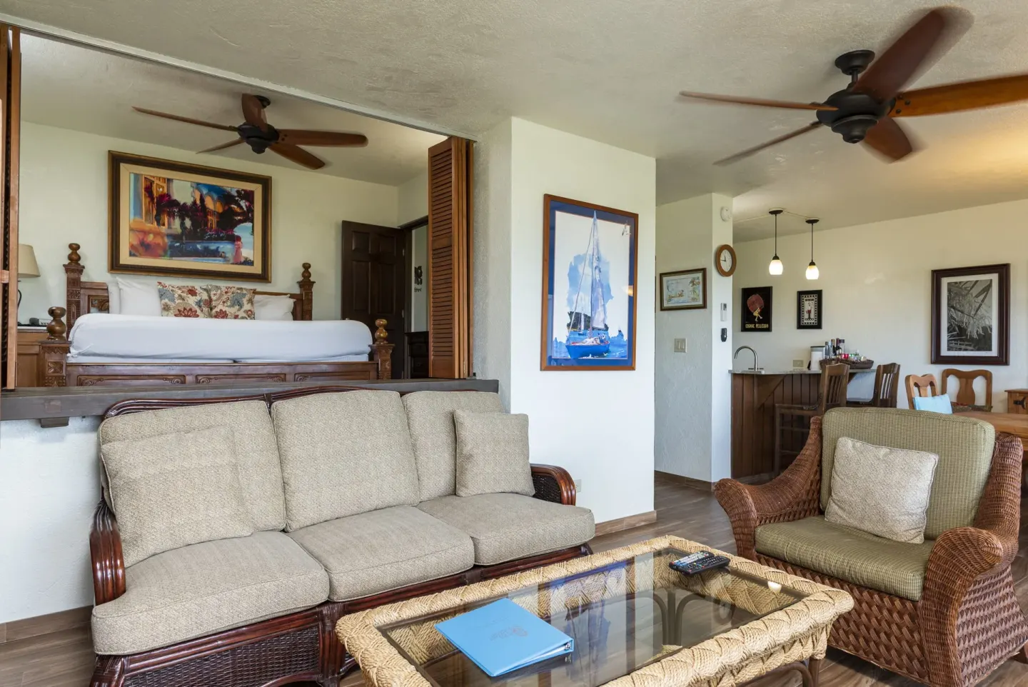 One-bedroom condo living area with raised bed and kitchenette at Point Pleasant Resort.