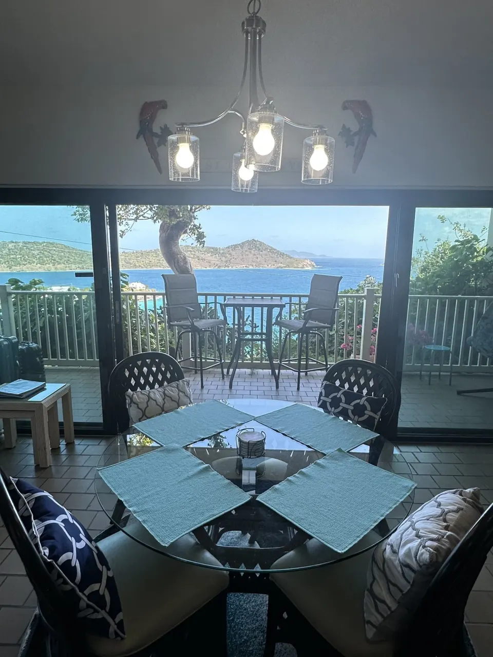 Studio dining area with balcony and ocean view at Point Pleasant Resort.