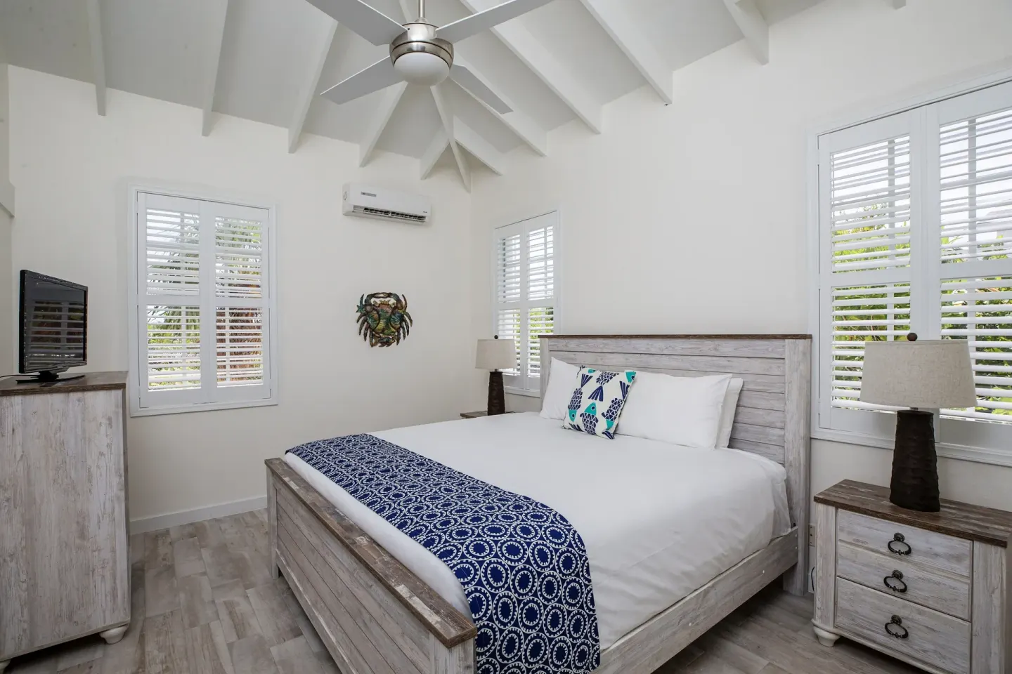 King bed guest room with vaulted ceiling at Ports of Call Resort.