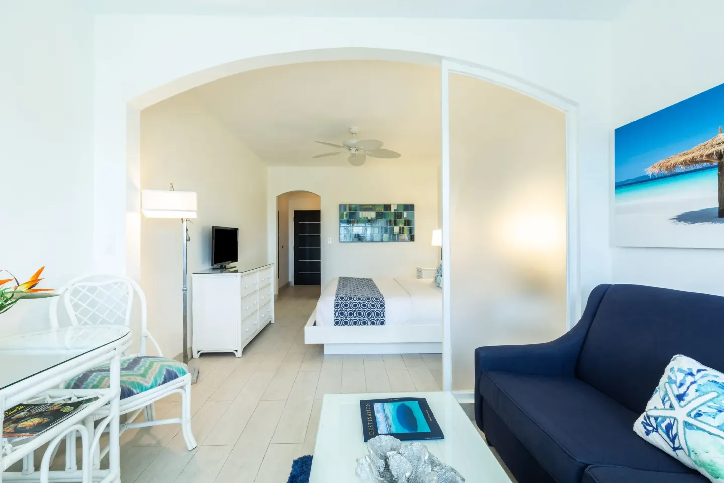 Guest room sitting area opening to a bed alcove at Ports of Call Resort.