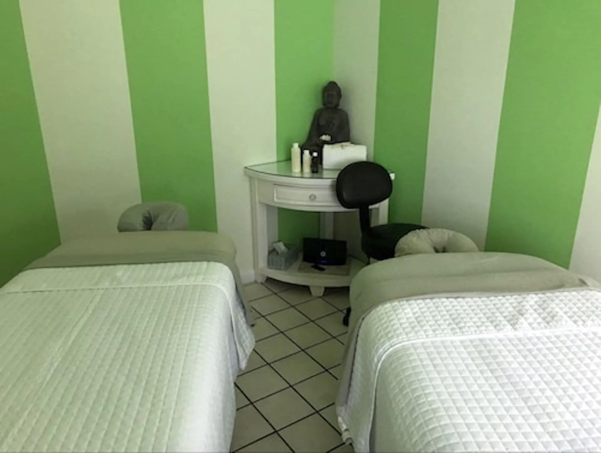 Spa treatment room with two massage tables at Ports of Call Resort.