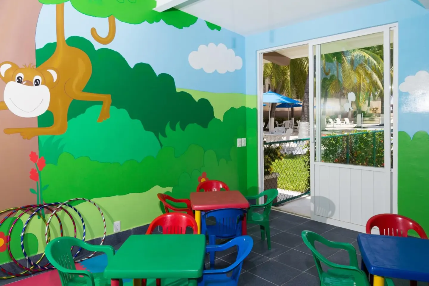 Colorful children’s playroom with small tables at Posada Real Ixtapa.
