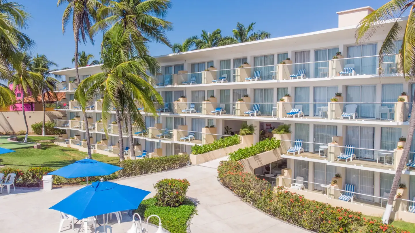 Guest-room balconies and landscaped walkways at Posada Real Ixtapa.