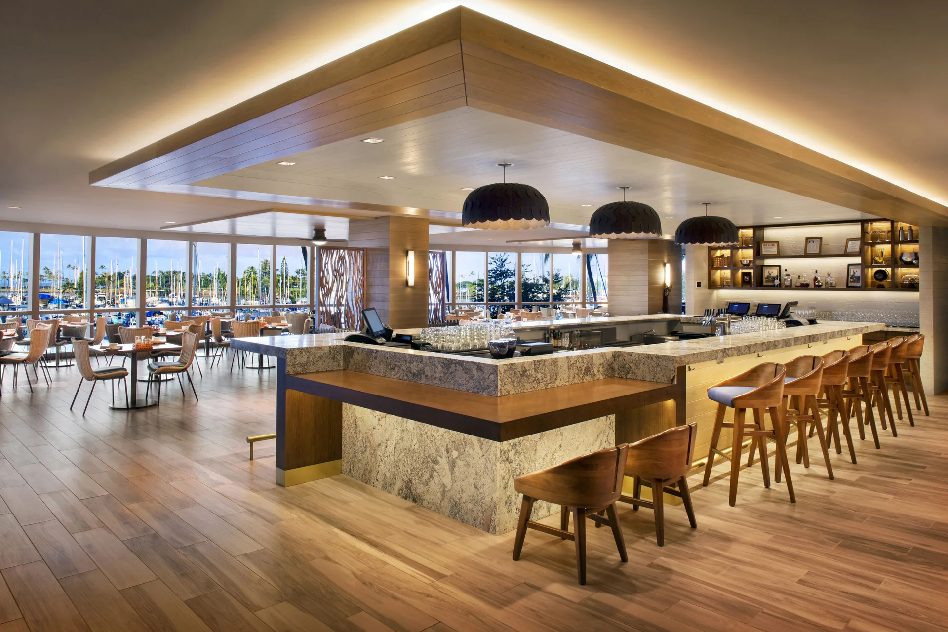 Open restaurant bar and dining room with marina views at Prince Waikiki.