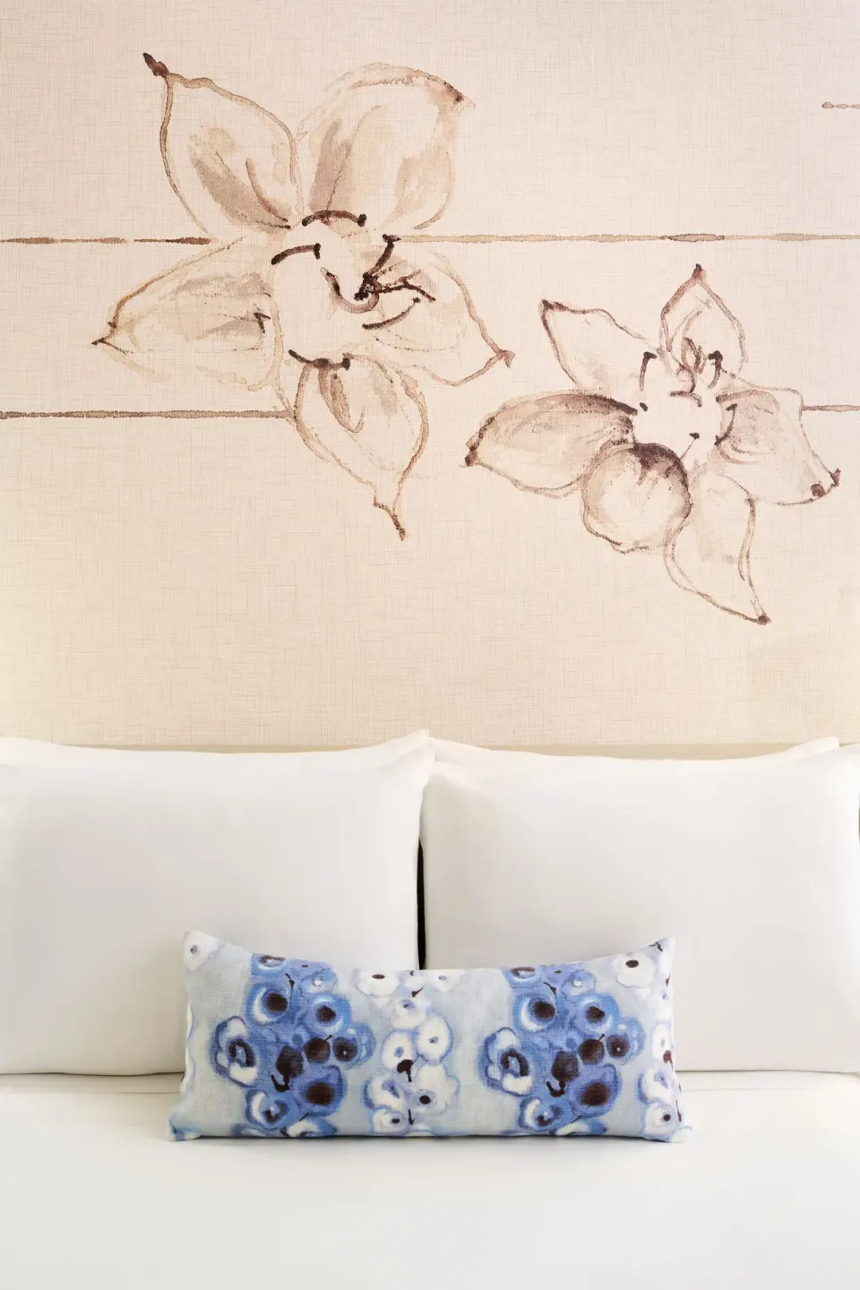Ocean Front 1 Bedroom Suite bed pillows and floral wall mural at Prince Waikiki.