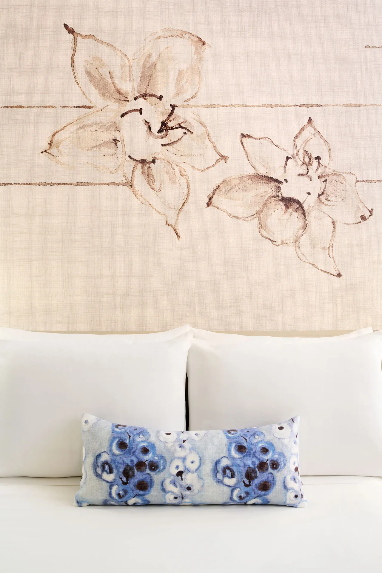 Ocean Front 1 Bedroom Suite bed pillows and floral wall mural at Prince Waikiki.