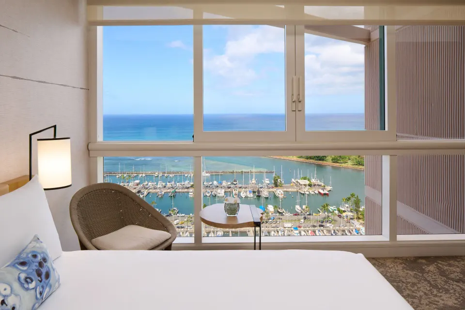 Ocean Front Premier bed area with marina and ocean view at Prince Waikiki.