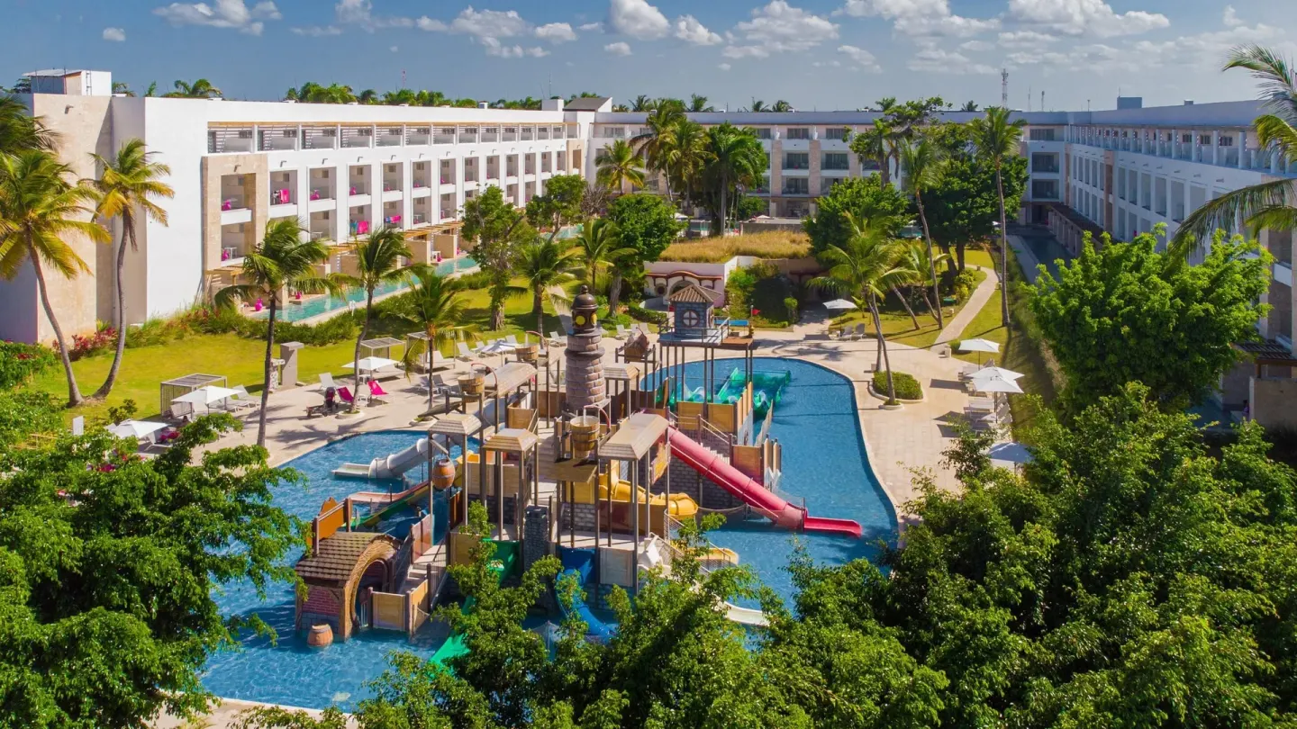 Aerial view of the kids' water park and resort buildings at Princess Family Club Bavaro.