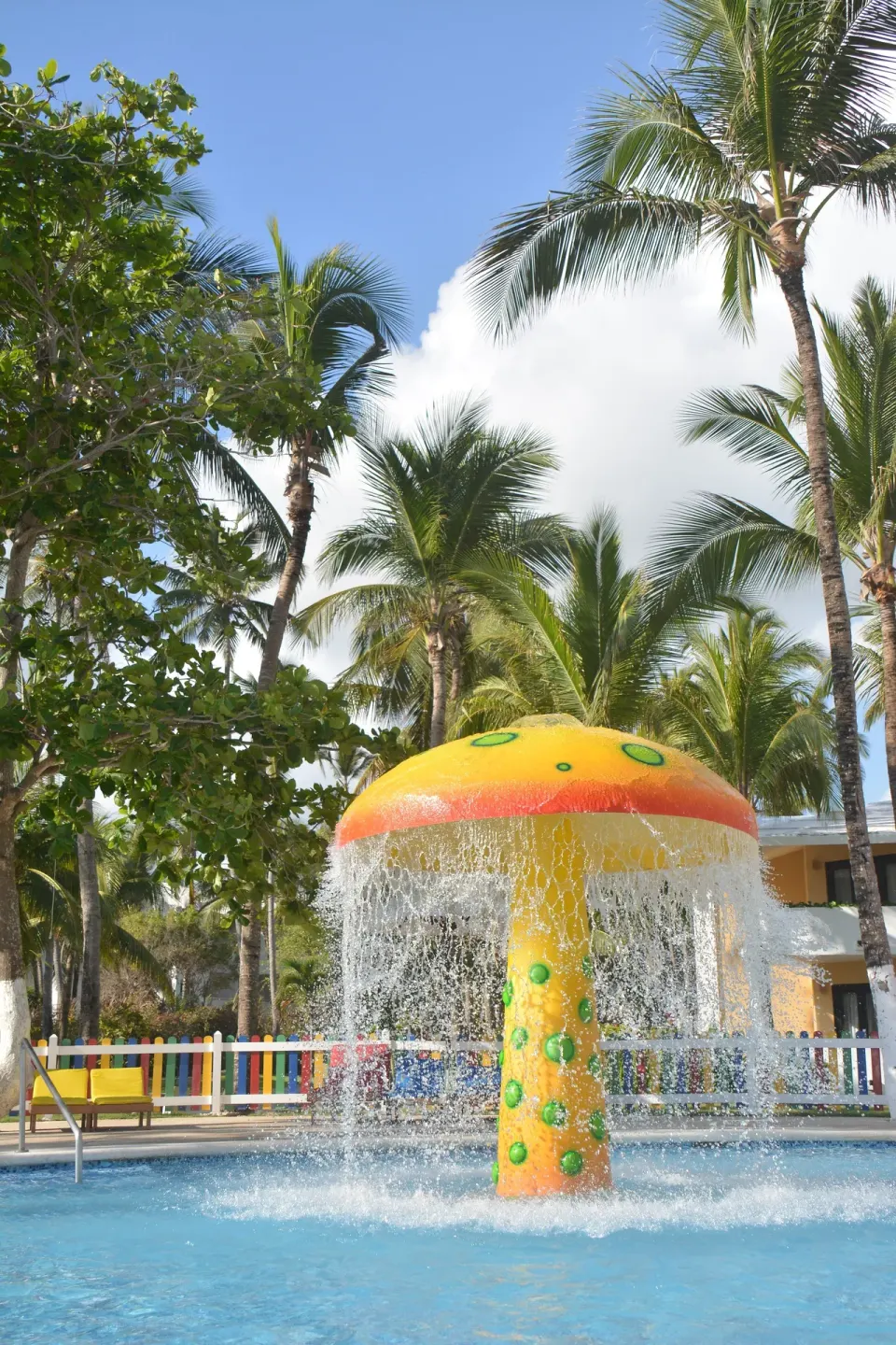 Mushroom water feature splashing in a children's pool at Princess Family Club Bavaro.