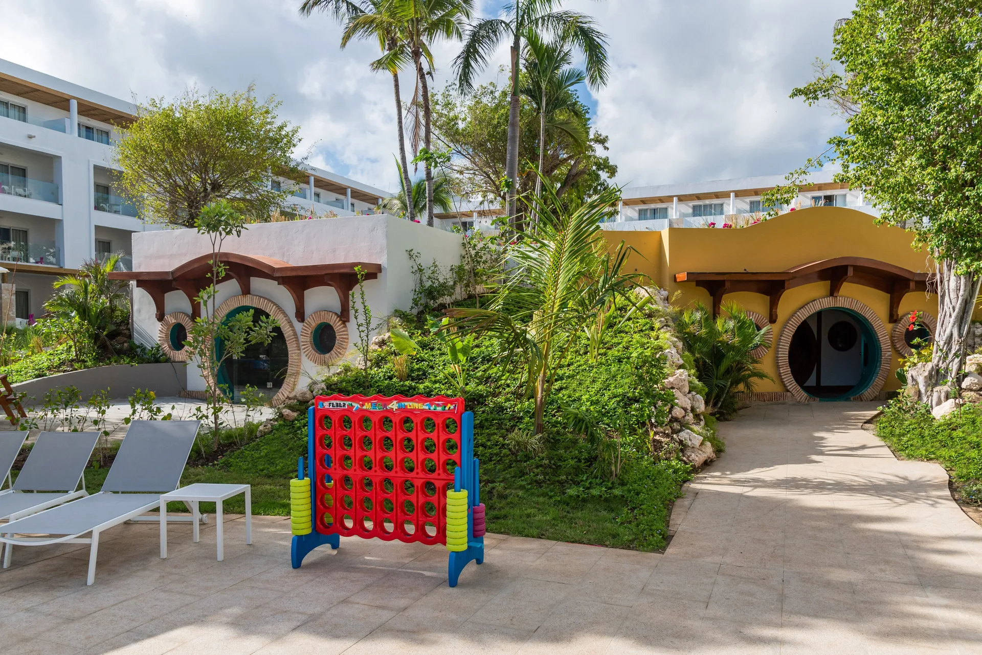 Outdoor family play area with giant Connect Four at Princess Family Club Bavaro.
