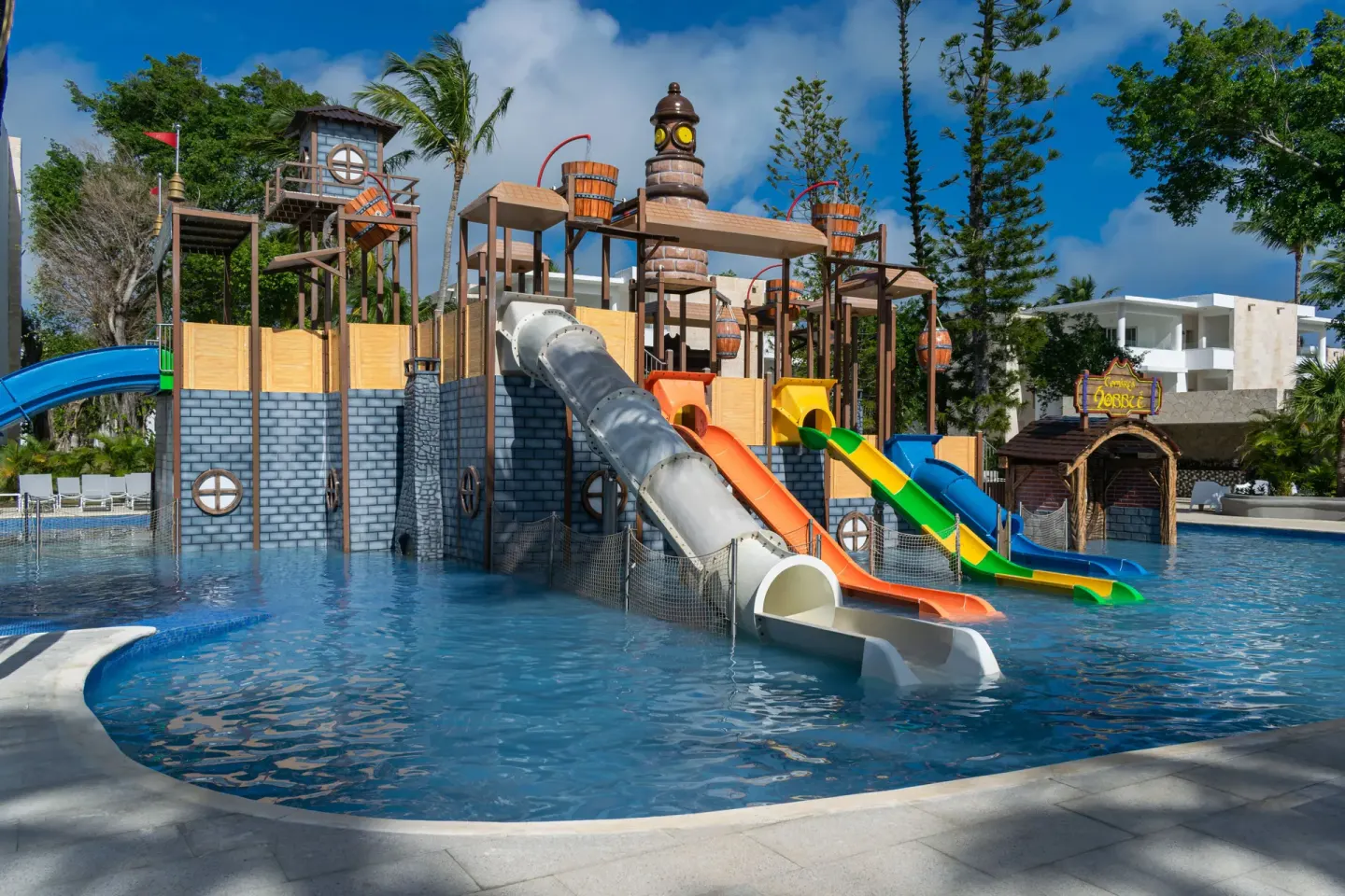 Pirate-themed splash pool with colorful slides at Princess Family Club Bavaro.