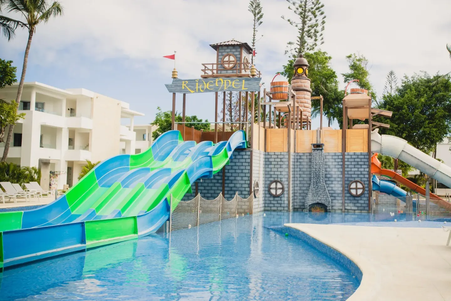 Pirate-themed water playground with slides and pool at Princess Family Club Bavaro.