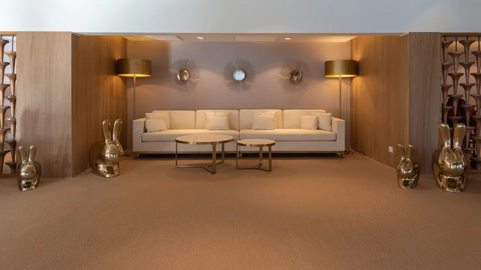 Lounge seating with gold rabbit sculptures at Princess Family Club Bavaro.