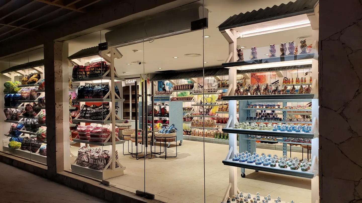 Resort shop window with souvenirs, clothing, and gifts at Princess Family Club Bavaro.