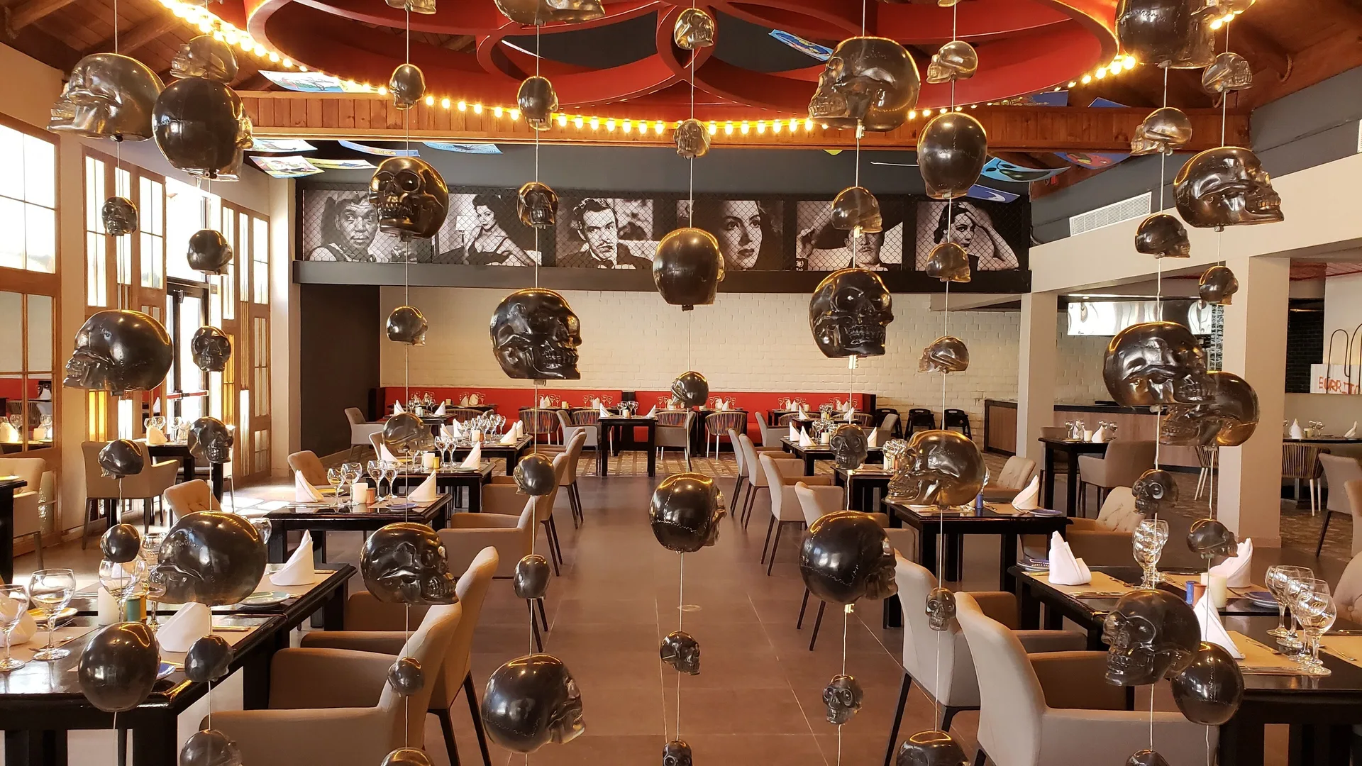 Themed restaurant dining room with hanging skull decor at Princess Family Club Bavaro.