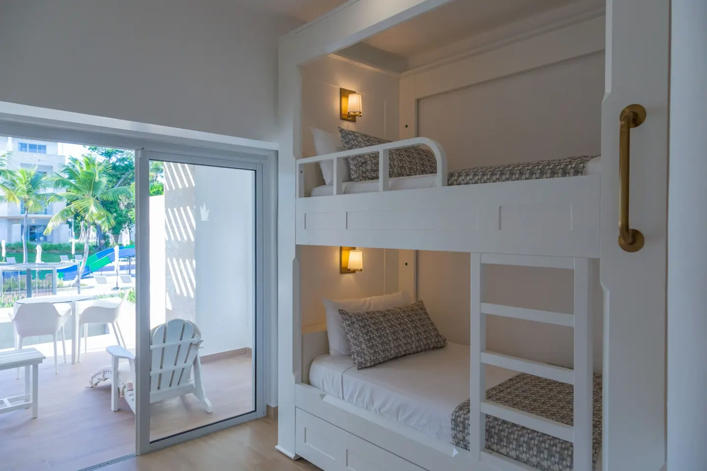 Family Club Junior Suite Swimout bunk beds beside terrace doors at Princess Family Club Bavaro.
