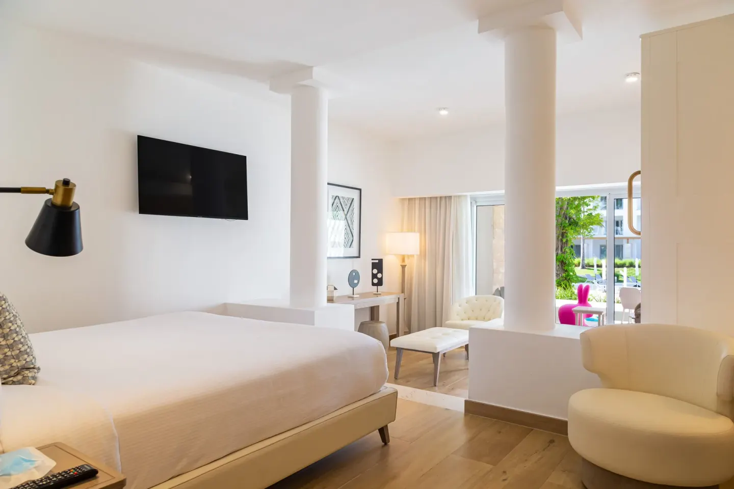 Family Club Junior Suite Swimout king bed and lounge area at Princess Family Club Bavaro.