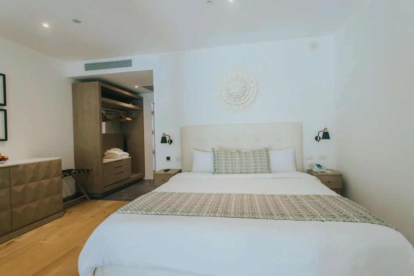 Family Club Junior Suite Swimout king bed with wardrobe behind at Princess Family Club Bavaro.