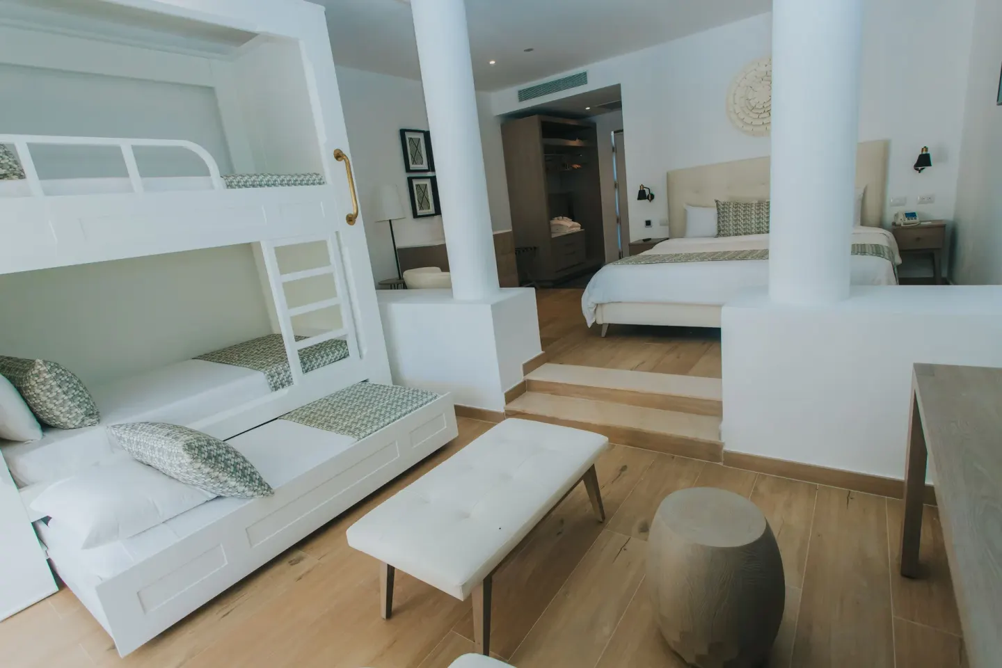 Family Club Junior Suite bunk bed area and king bed at Princess Family Club Bavaro.