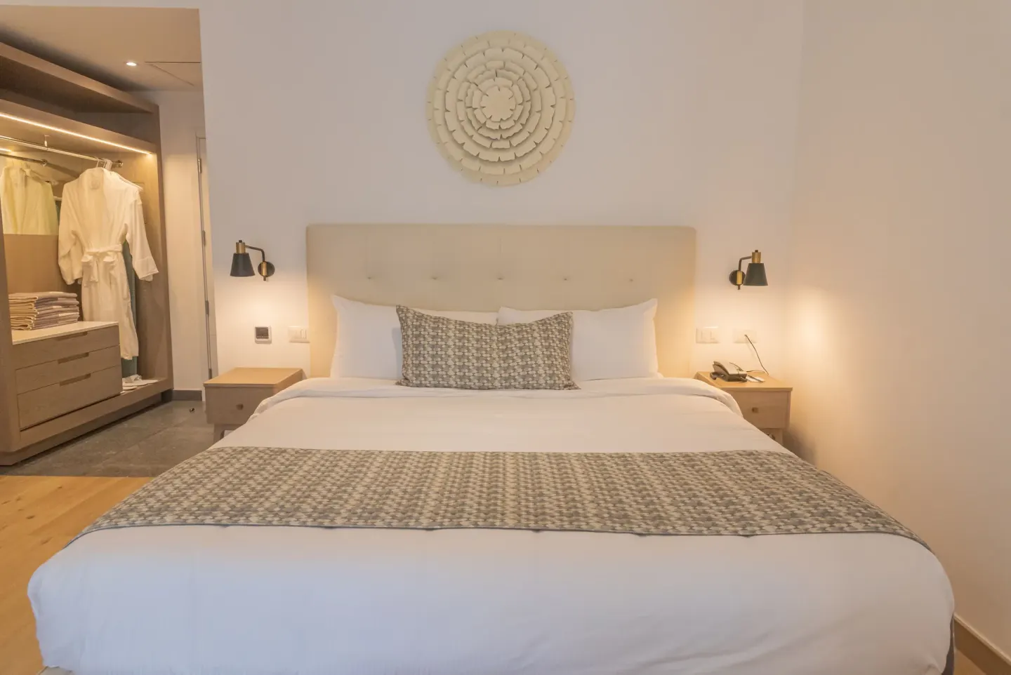 Family Club Junior Suite king bed and open closet at Princess Family Club Bavaro.