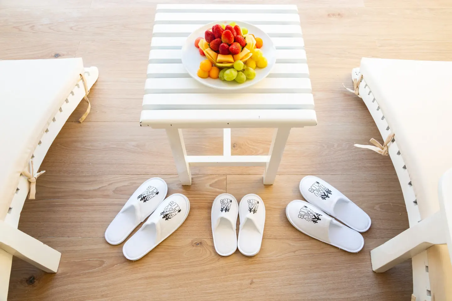 Family Club Junior Suite lounge setup with slippers and fruit at Princess Family Club Bavaro.