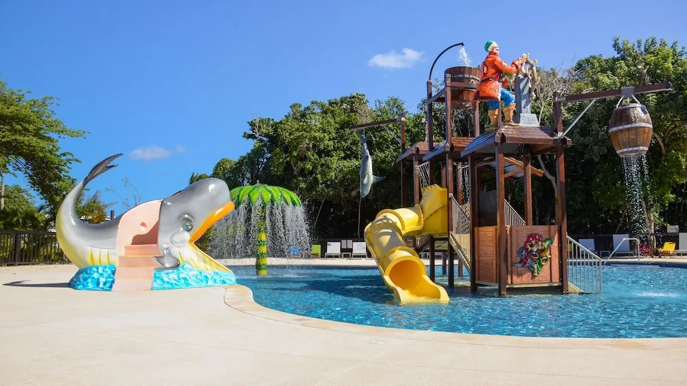 Pirate splash playground with whale slide and yellow tube slide at Princess Family Club Riviera.