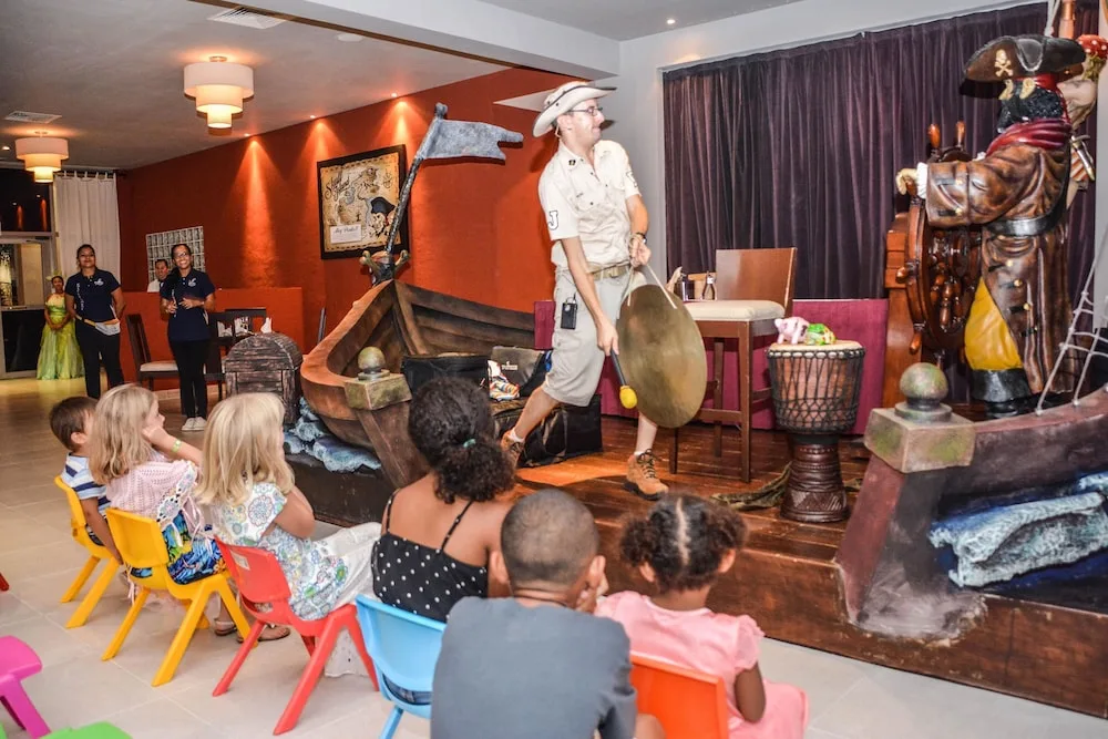 Children watch a pirate-themed performance at Princess Family Club Riviera.