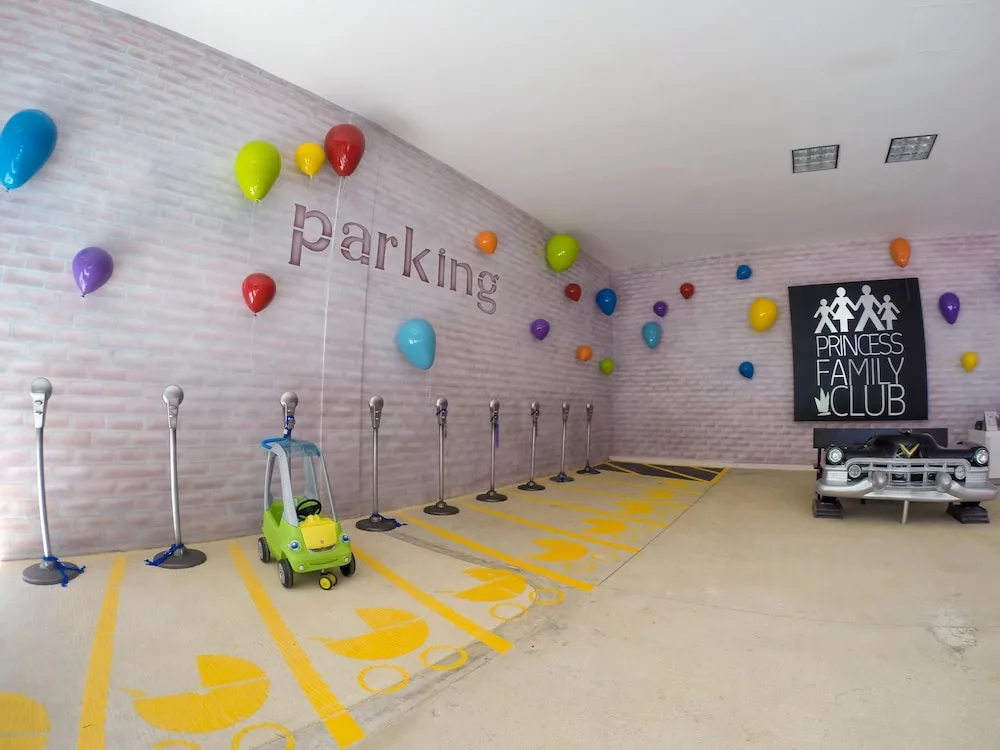 Toy car parking lanes with balloon wall decor at Princess Family Club Riviera.
